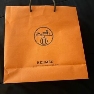 Hermes Orange Shopping Bag with Glossy Finish and Iconic Logo